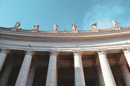 Pope Leo’s AI Encyclical Goes Beyond Artificial Intelligence Exterior columns of a grand Vatican-style building representing institutional authority