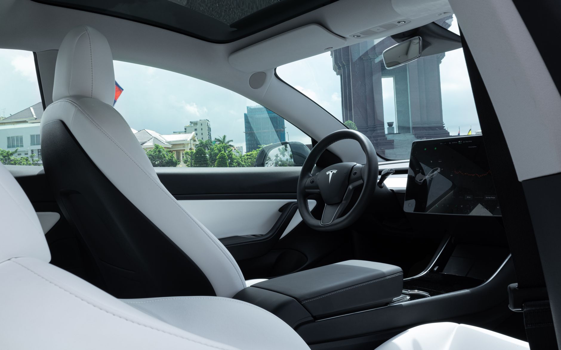 Sleek luxury electric vehicle exterior at a reveal event