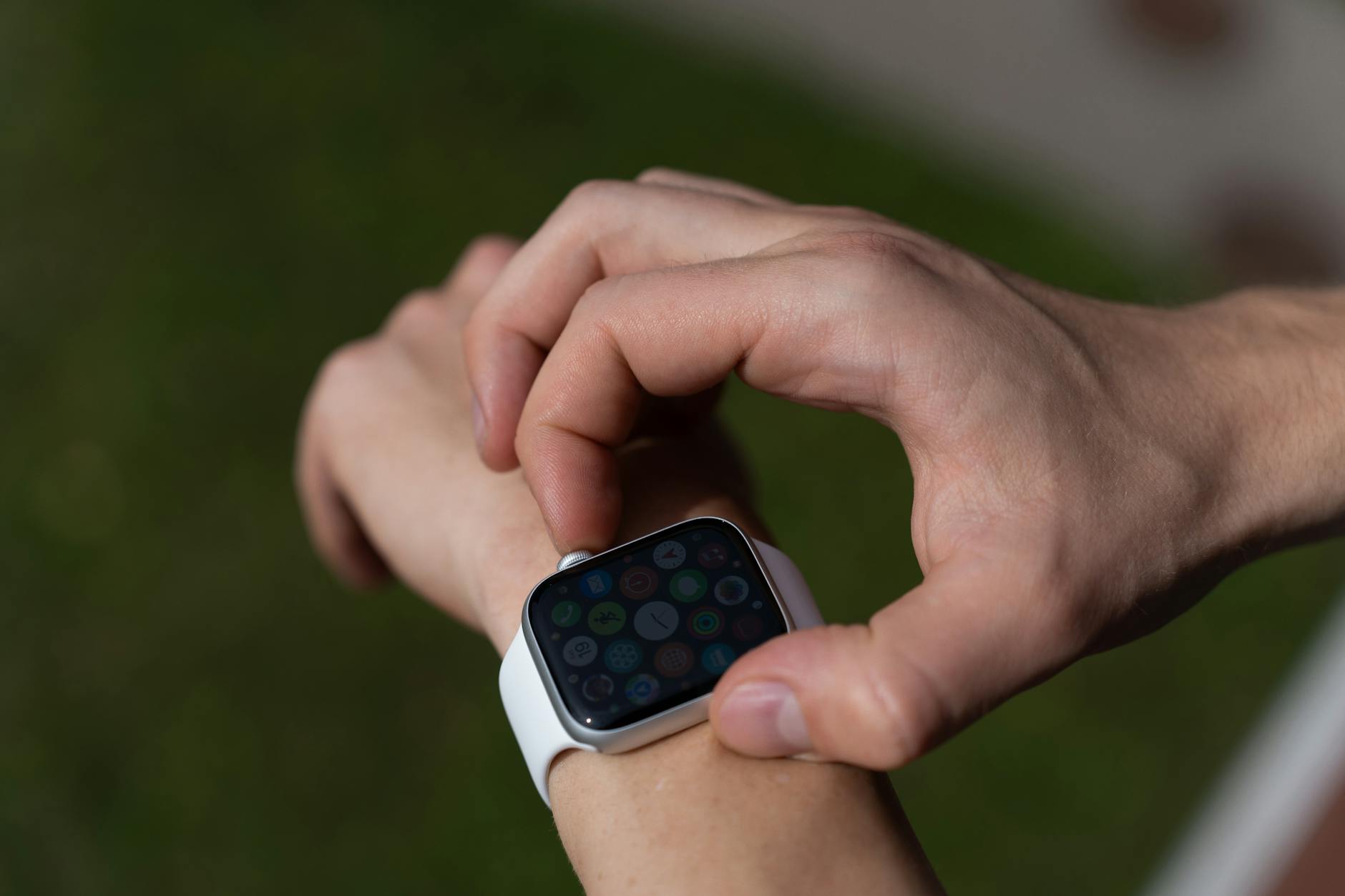 Close-up of a screenless fitness tracker worn on a wrist