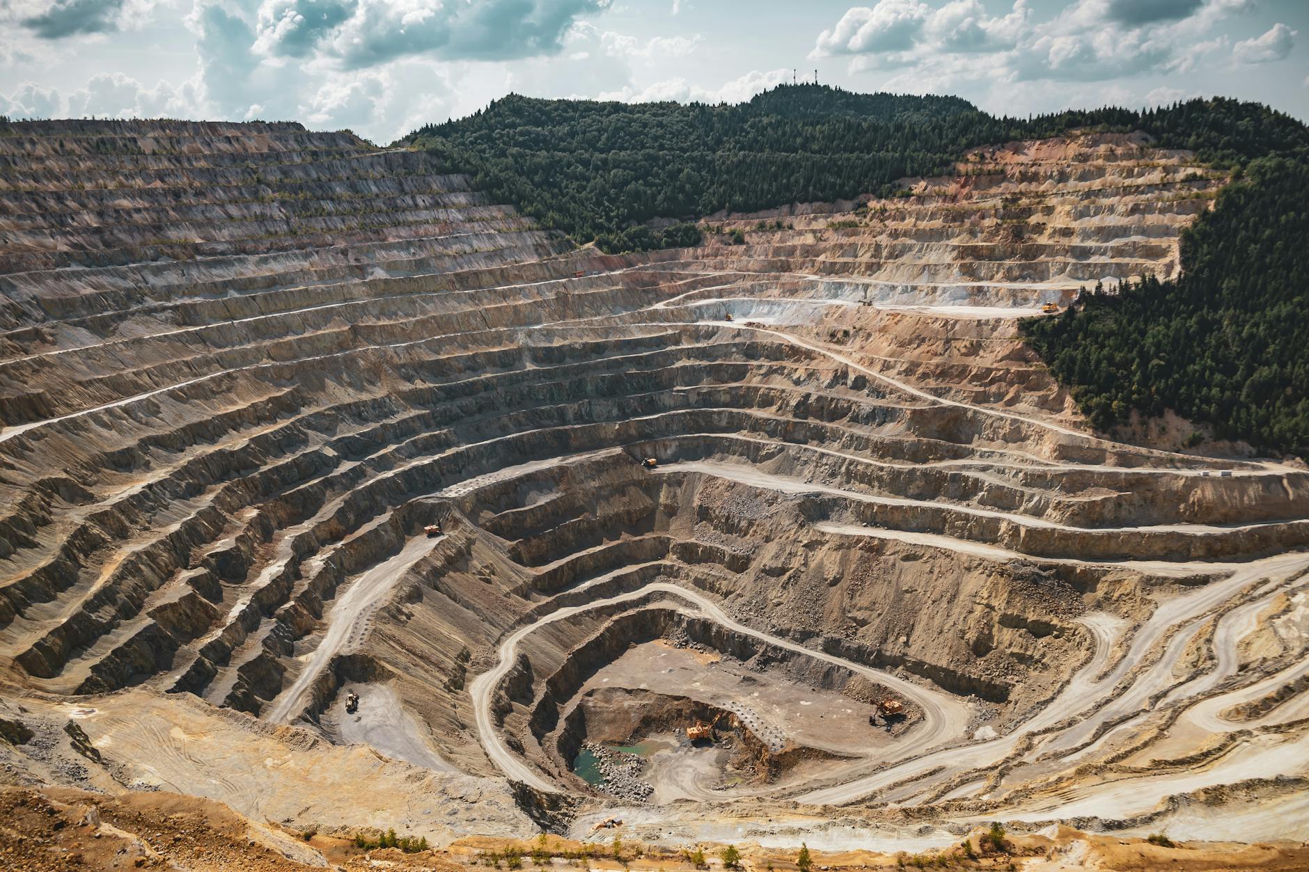 Open pit lithium mining operation with exposed rock and machinery