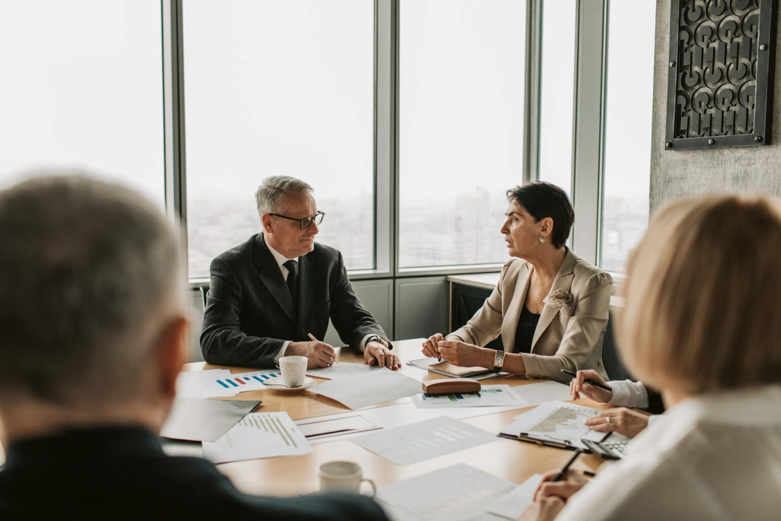 Corporate boardroom with empty chairs around conference table