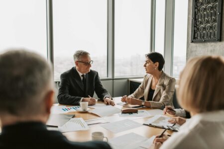Corporate boardroom with empty chairs around conference table