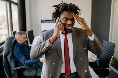 Person having phone conversation in modern office setting