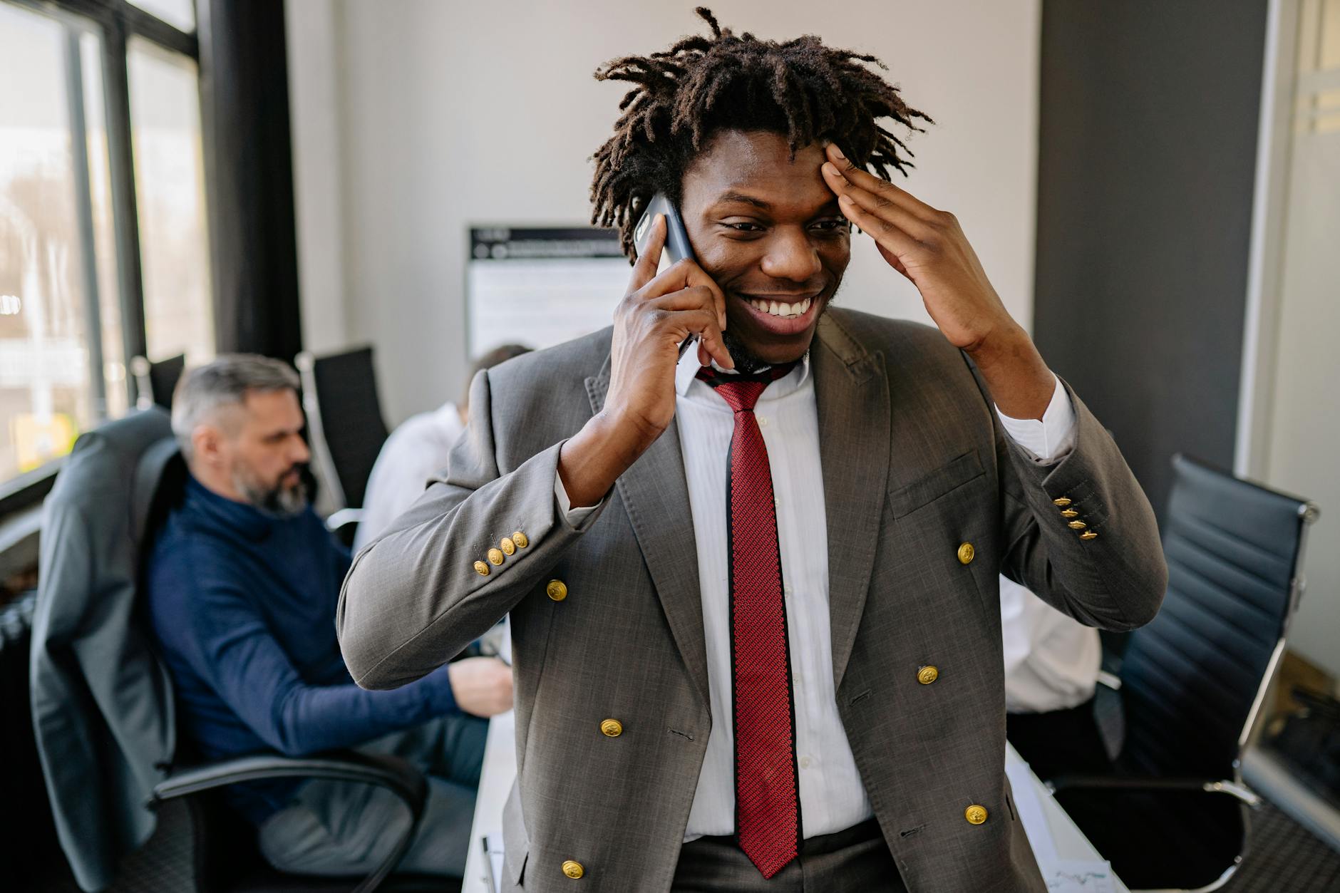 Person having phone conversation in modern office setting