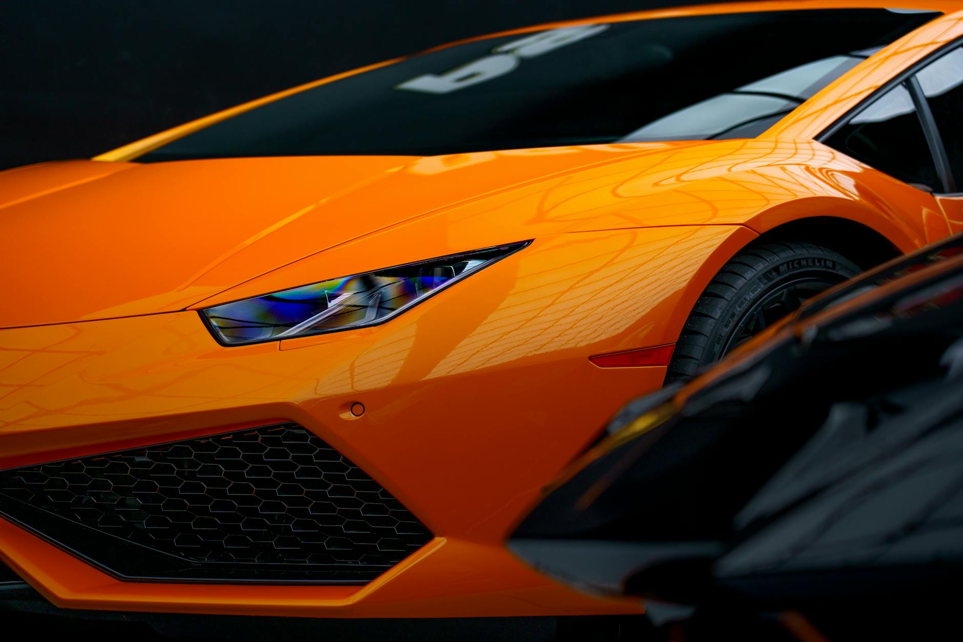 Luxury sports car on display in modern showroom setting
