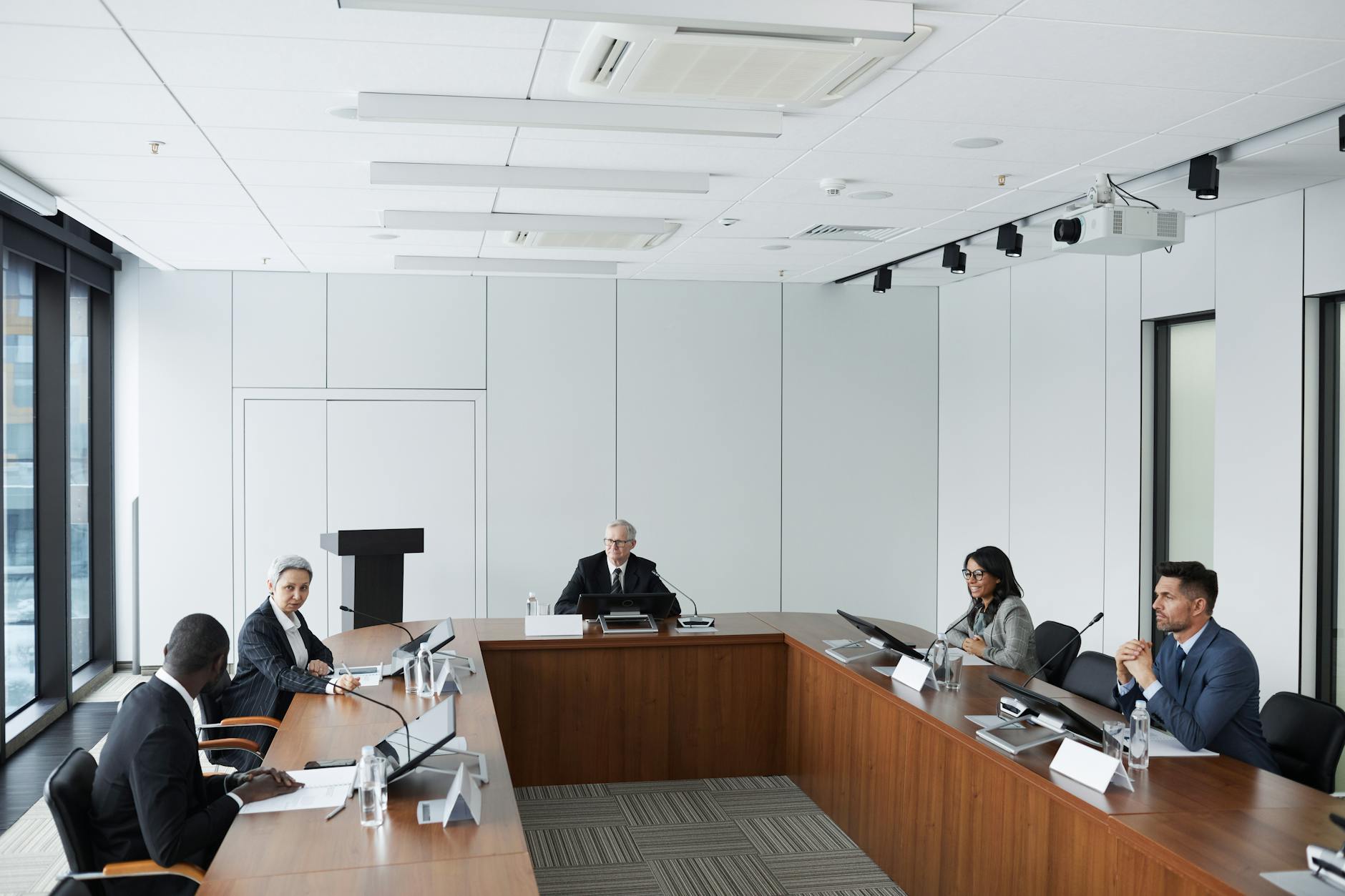 Business professionals in meeting discussing technology solutions