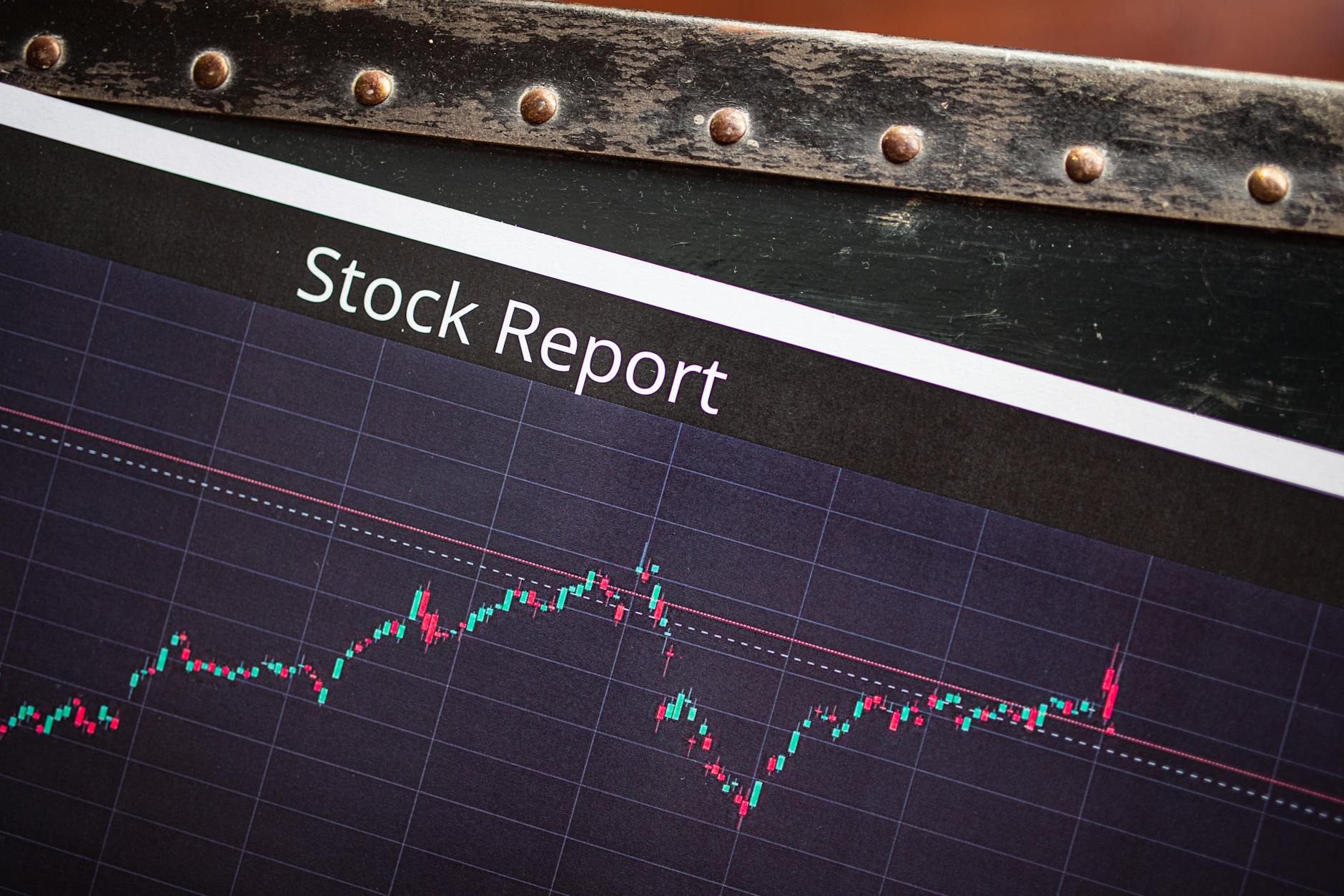 Financial charts and trading data on computer screens