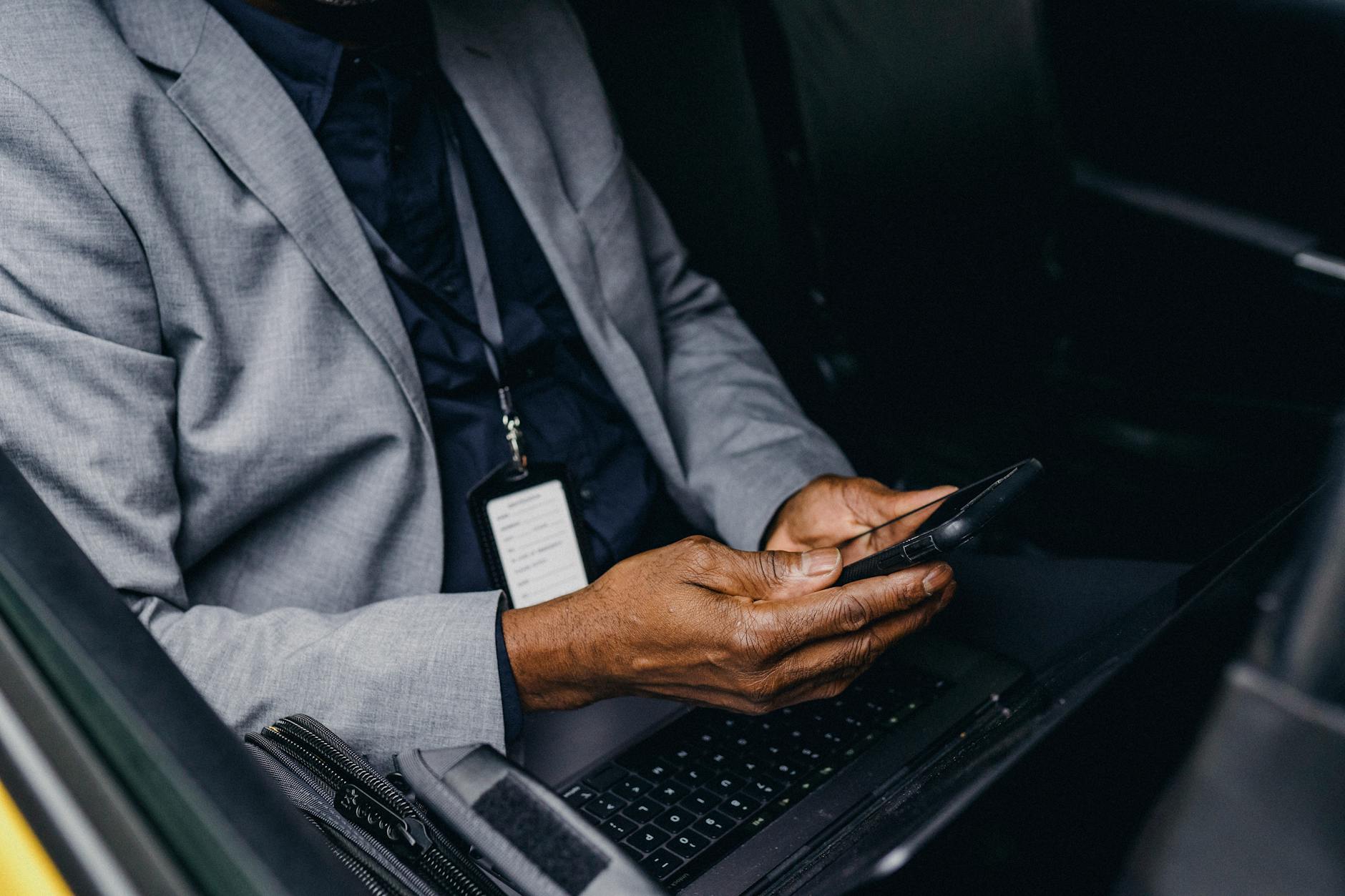 Business executive using a high-end smartphone in a professional setting