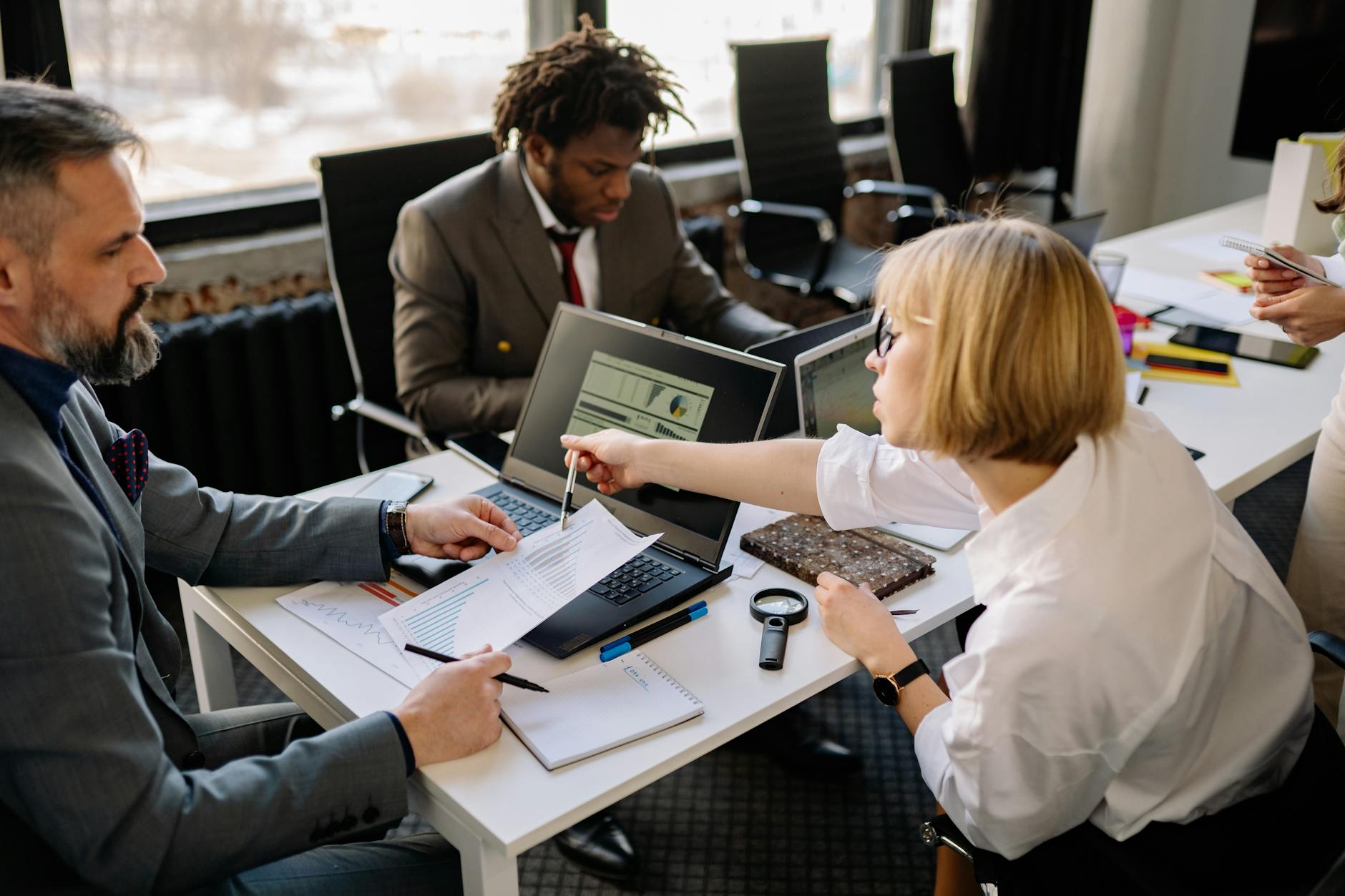 Cross-functional team working together on security planning documents