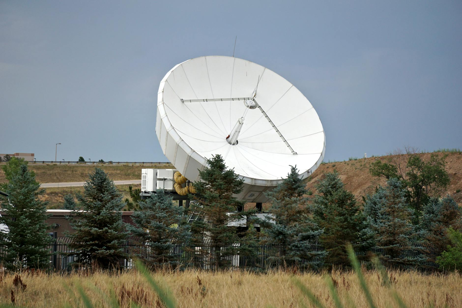 Satellite orbiting Earth in space with communication signals