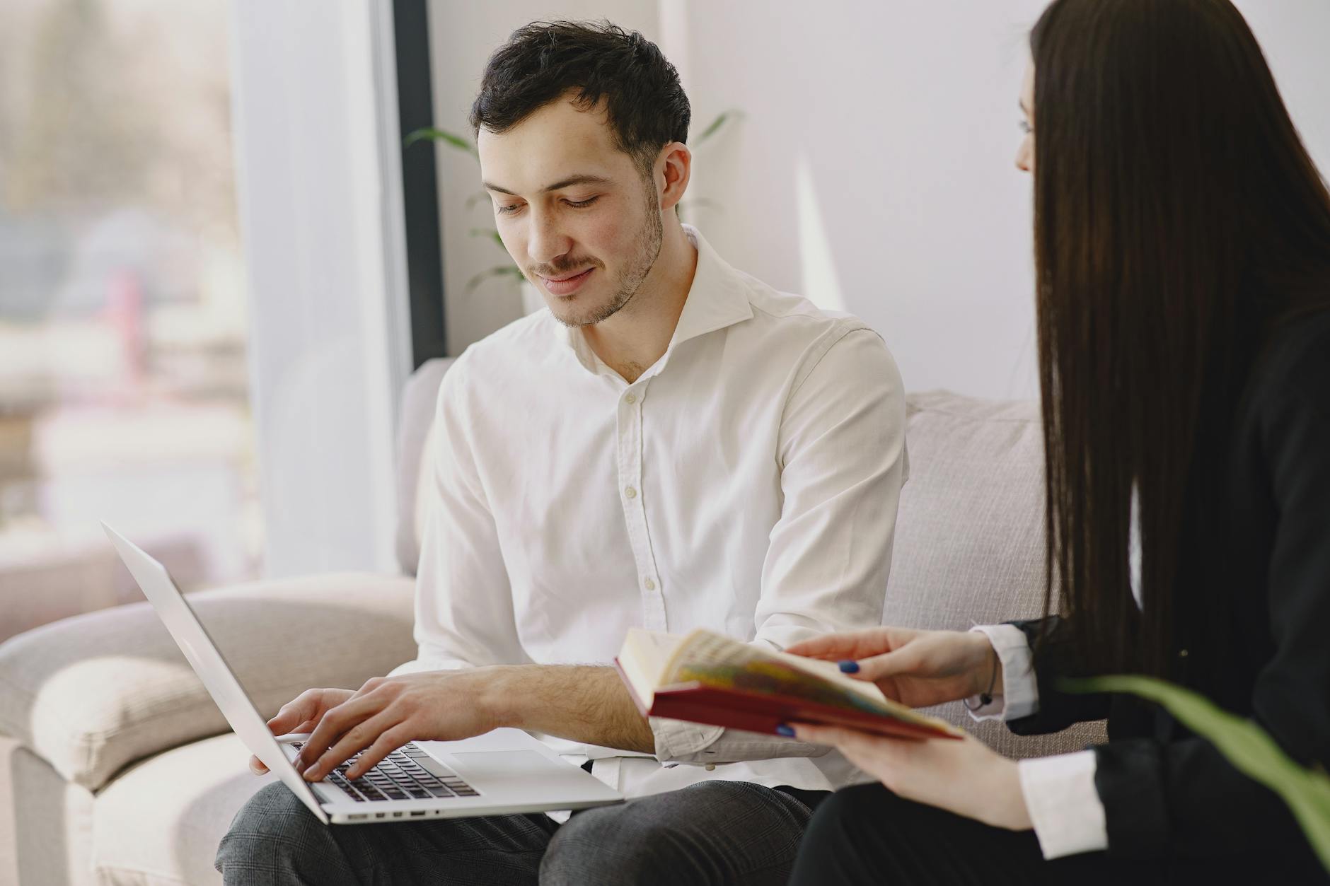 Young professional working on laptop representing recent college graduates entering the job market