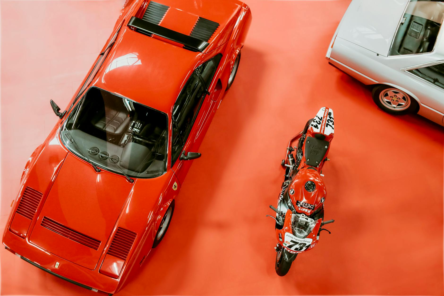 Red Ferrari sports car on display at an automotive event