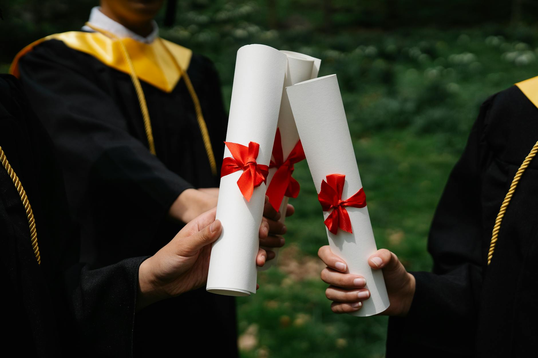 A recent college graduate holding a diploma, symbolizing the transition from education to workforce