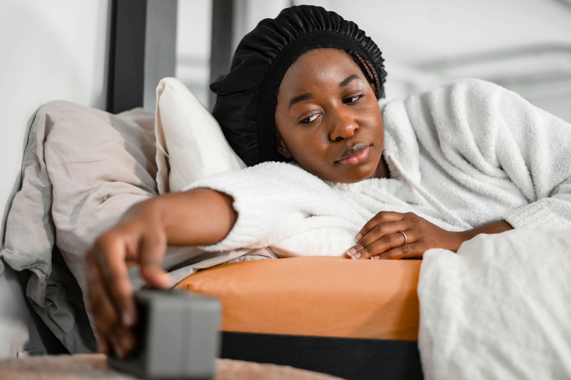 Person resting with a fitness tracker monitoring sleep and recovery