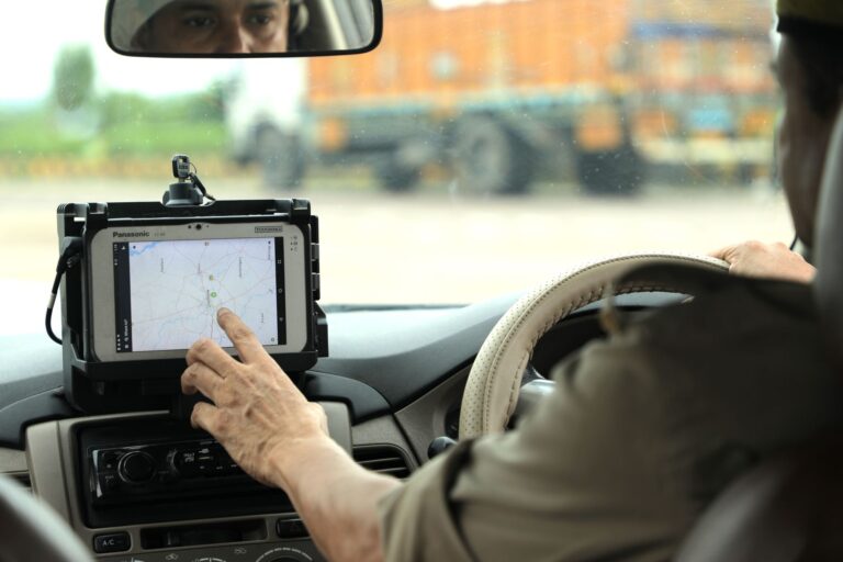 A police officer reviewing digital surveillance footage on a computer screen