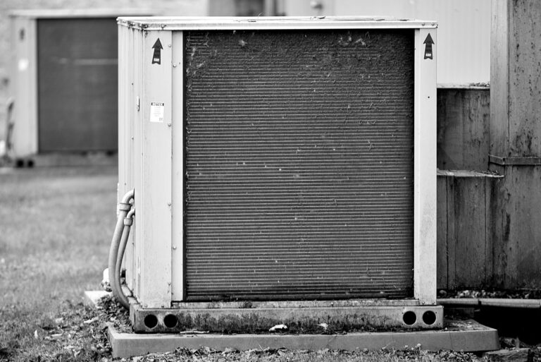 Solid-State ACs Are Coming. Scientists Question If Exterior wall-mounted air conditioning unit on a residential building
