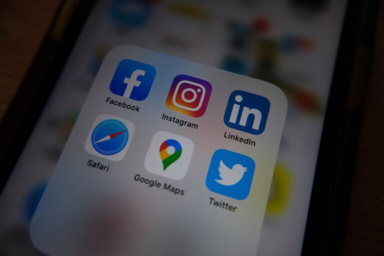 Zuckerberg Orders Meta to Build Its Own Prediction Market A smartphone displaying a social media feed on a desk