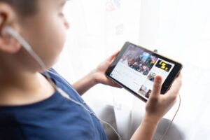 Young child watching video content on a tablet screen