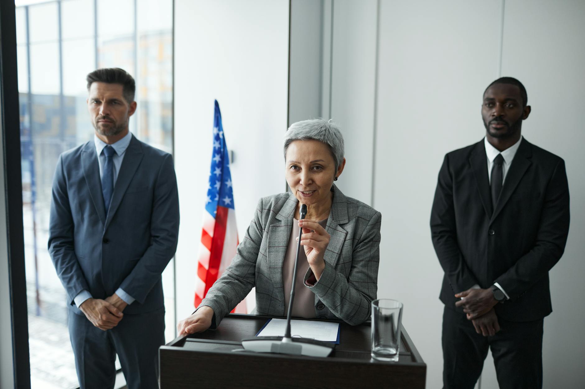 Officials in a formal meeting discussing technology regulation and AI governance