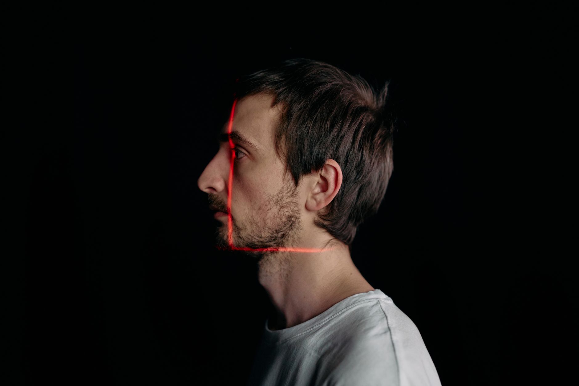 A digital interface displaying facial recognition scanning overlays on a face