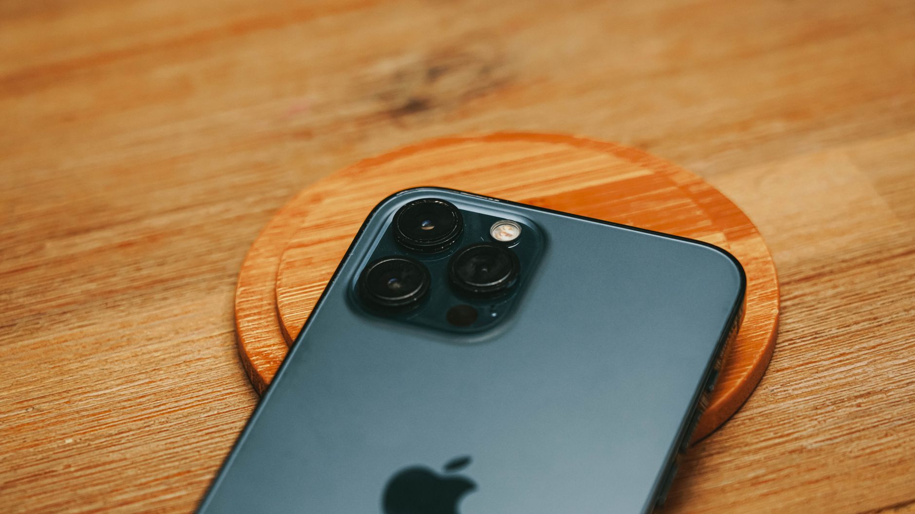Small electronic device charging wirelessly on a pad