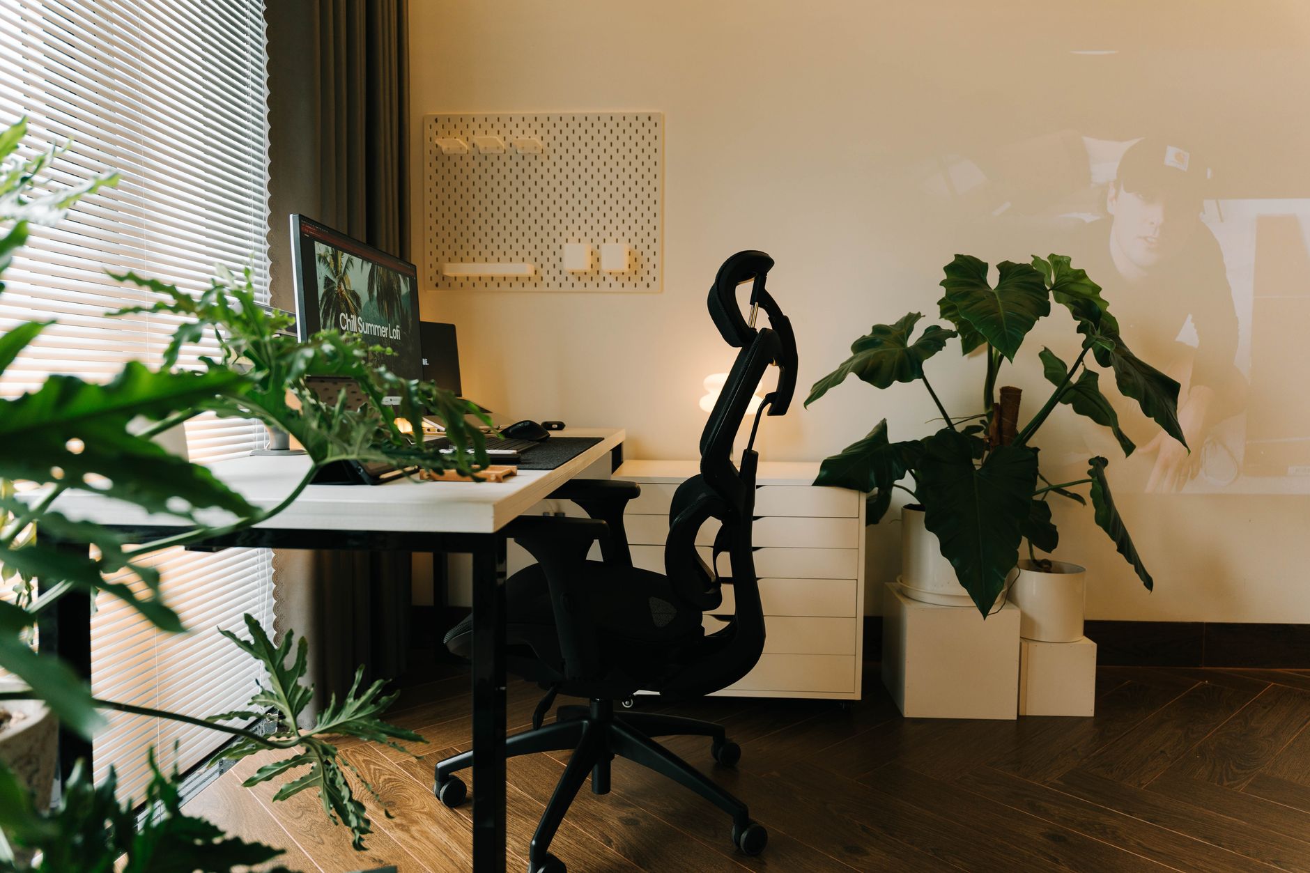 An ergonomic office chair positioned at a clean desk workspace