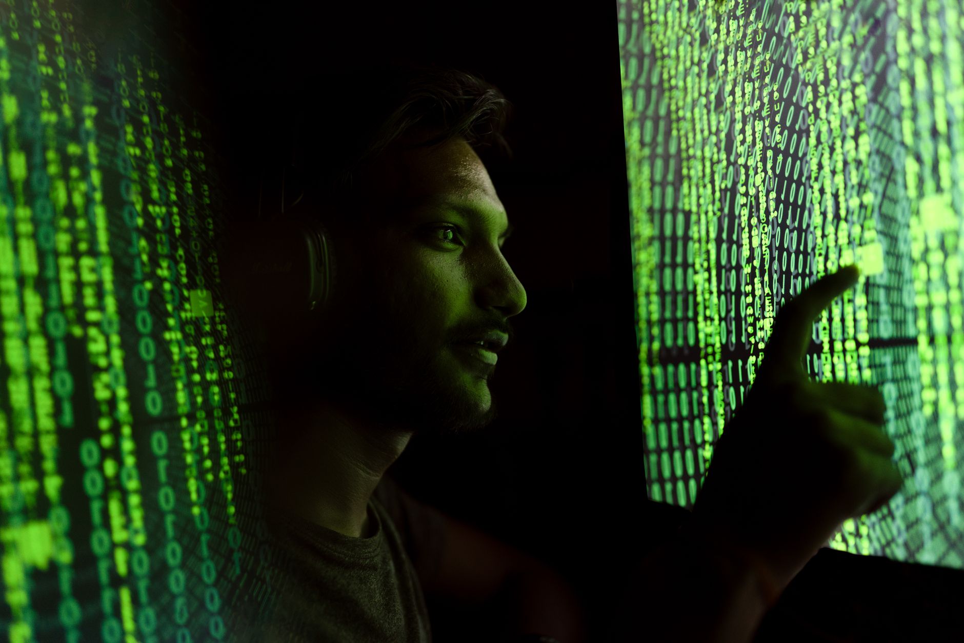Cybersecurity researcher working at a computer analyzing security vulnerabilities