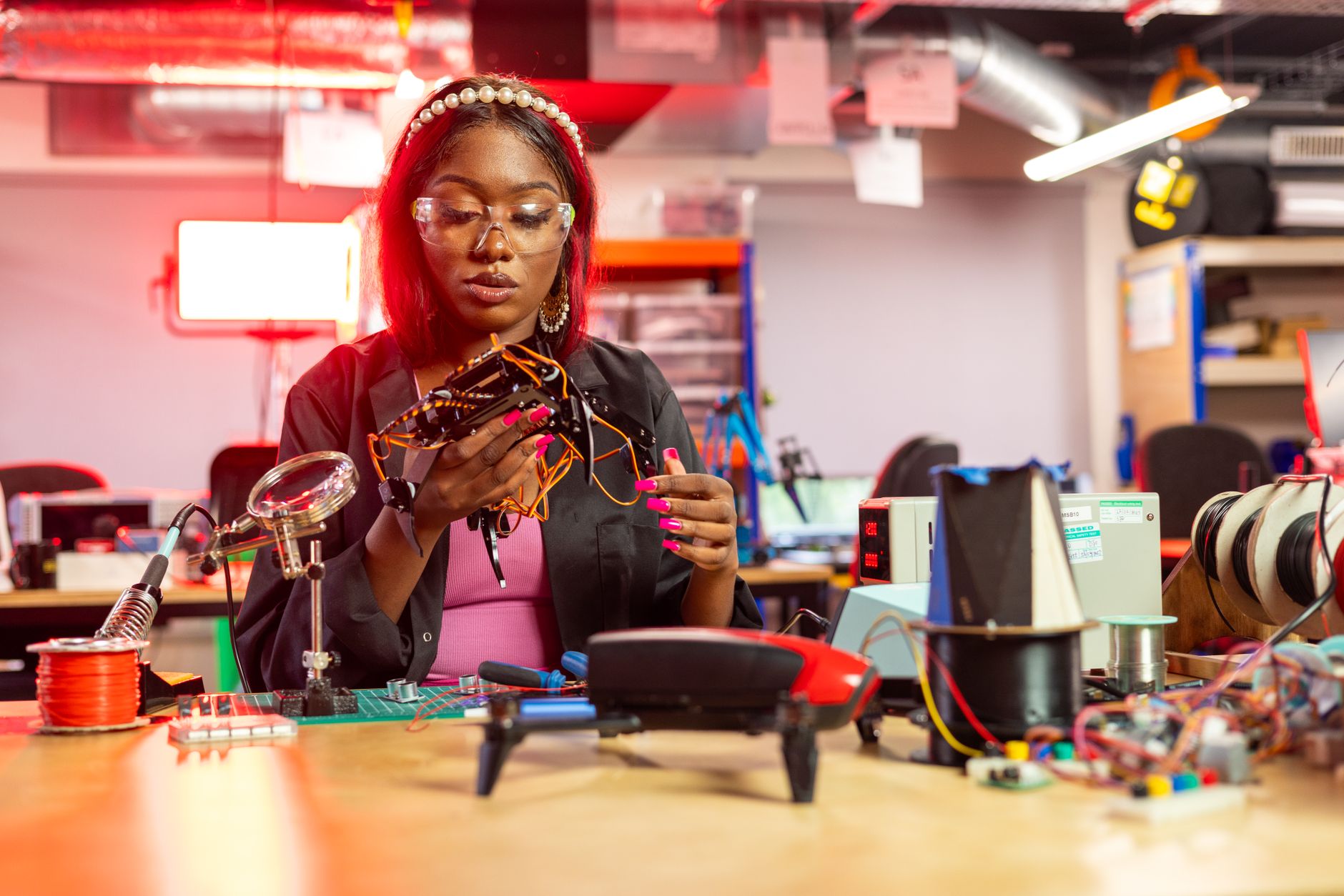 Engineers observing robotic vehicle tests in a controlled laboratory environment