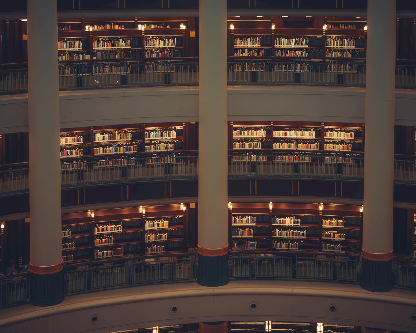 Rows of books inside a public library