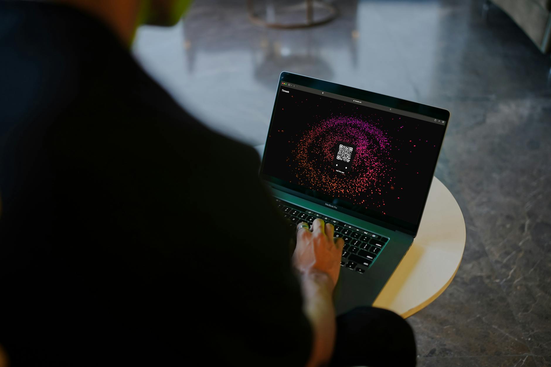 Person working on a laptop with a focus on digital security settings
