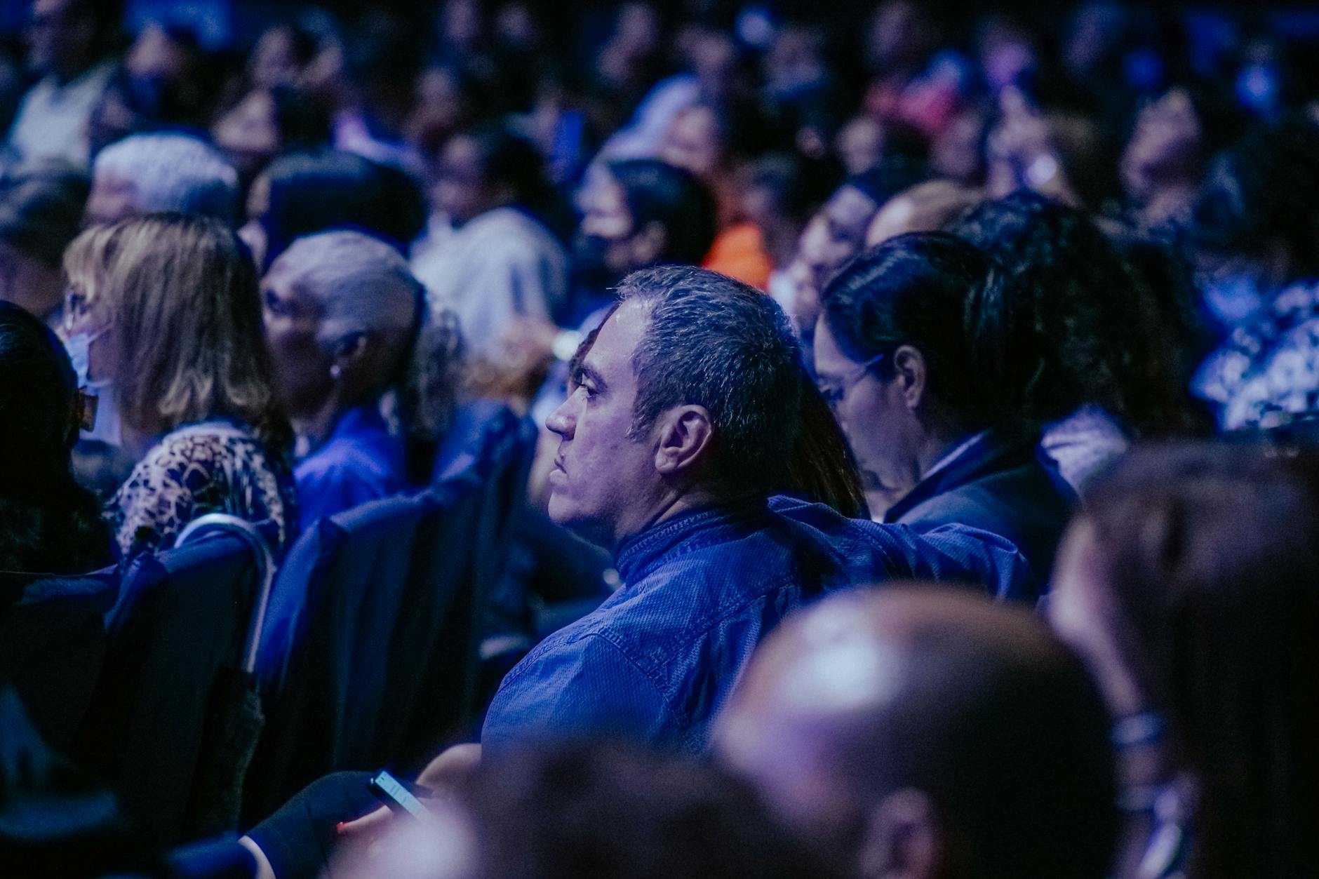 Large audience seated at an indoor technology conference