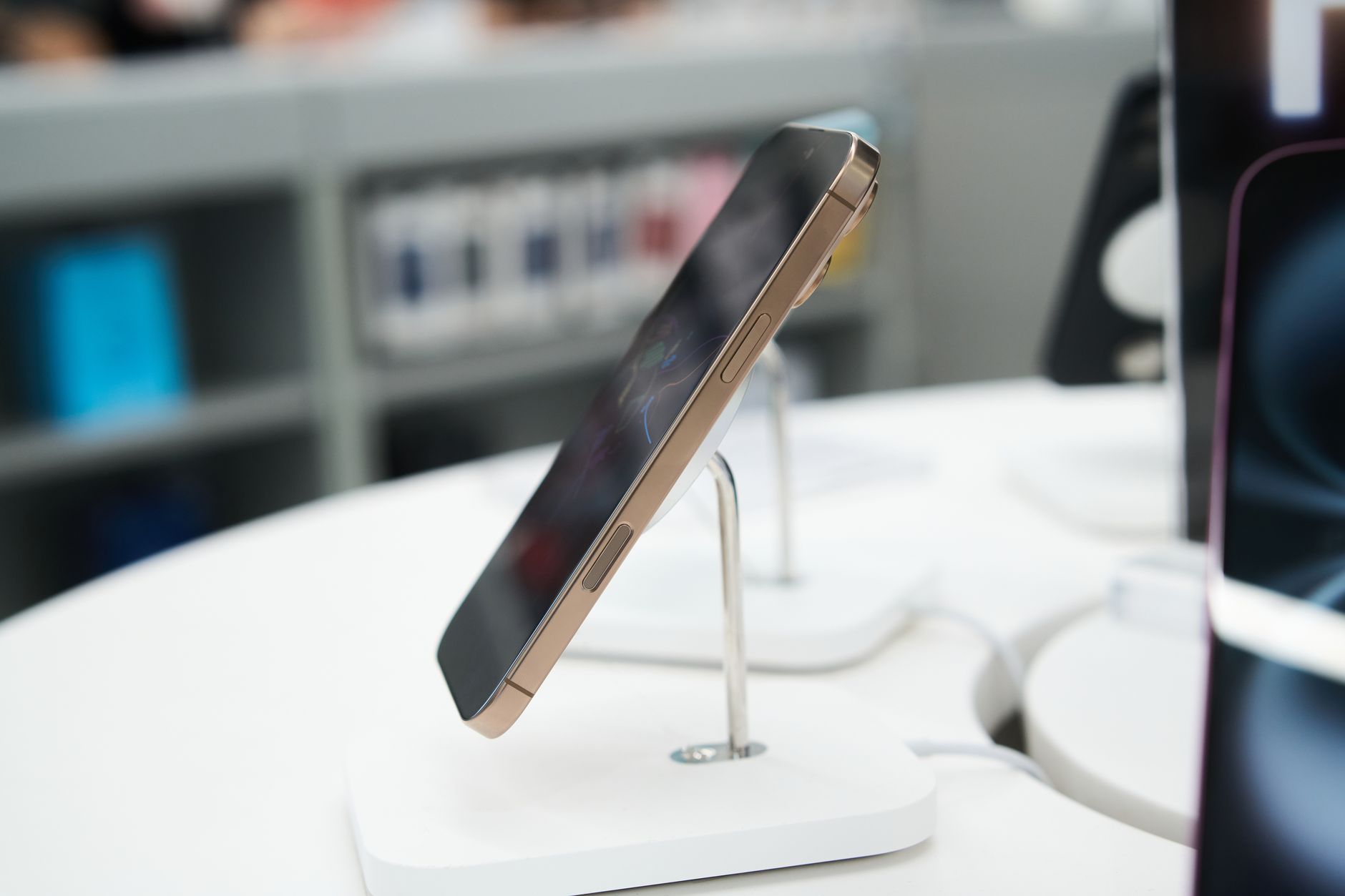Customers browsing smartphones at a technology retail store