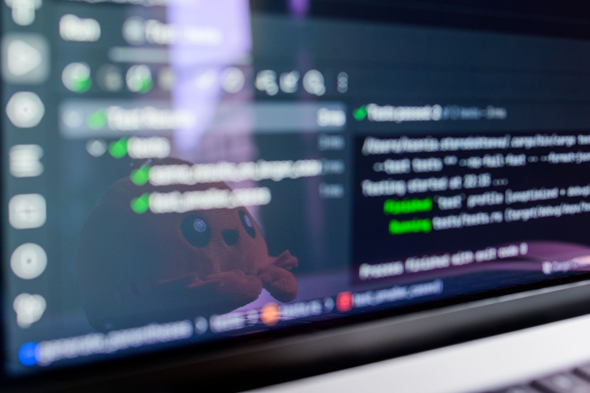 Developer reviewing code on multiple monitors