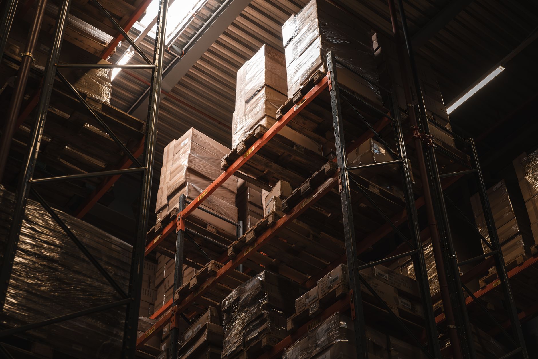 Empty warehouse shelves representing a product shipping backlog