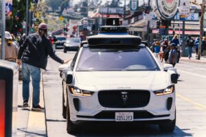 Waymo Drops Human Supervisors in Four More U.S. Cities A self-driving autonomous vehicle on a city street