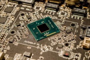 Meta’s new AI chips will begin production in September Closeup of a semiconductor microchip on a circuit board