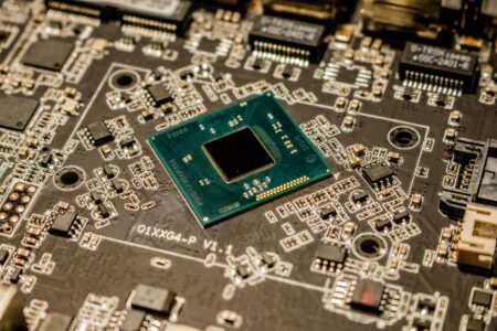 Meta’s new AI chips will begin production in September Closeup of a semiconductor microchip on a circuit board