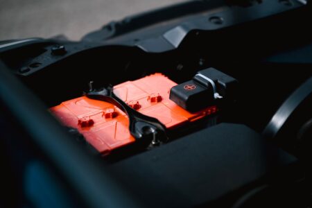 ProLogium Bets Solid-State Batteries Can Break Researcher working on battery cells in a laboratory setting
