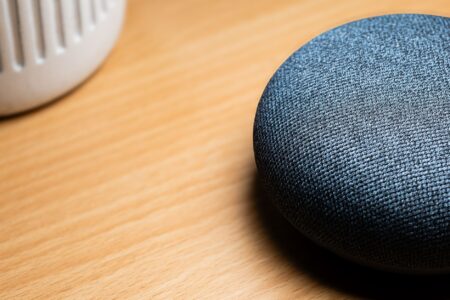 A smart home hub device sitting on a desk connected to a home network