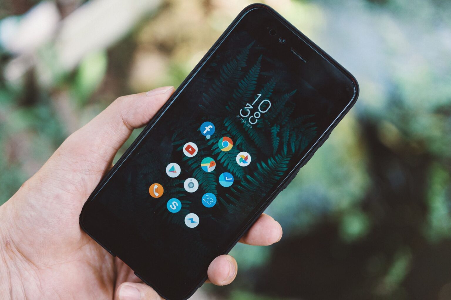 Sonos App Gets Tab Navigation and Speaker Sorting in Latest Update Person navigating a mobile app interface on a smartphone