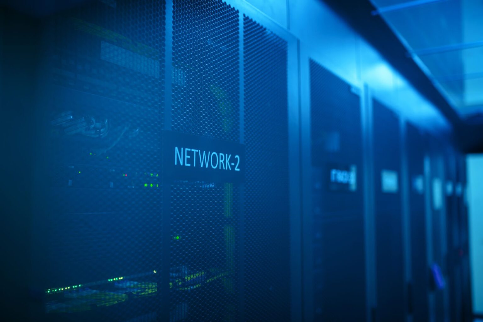 OpenAI called the Hugging Face attack unprecedented. But we’ve been here before. Rows of servers in a secure data center with blue lighting