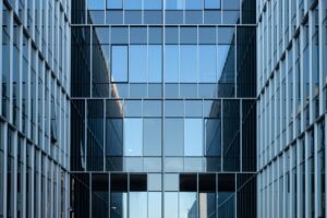 Large corporate office building exterior representing enterprise workforce changes