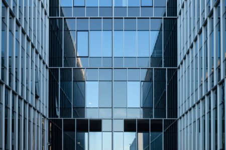 Large corporate office building exterior representing enterprise workforce changes