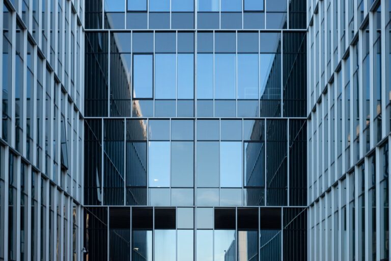 Large corporate office building exterior representing enterprise workforce changes