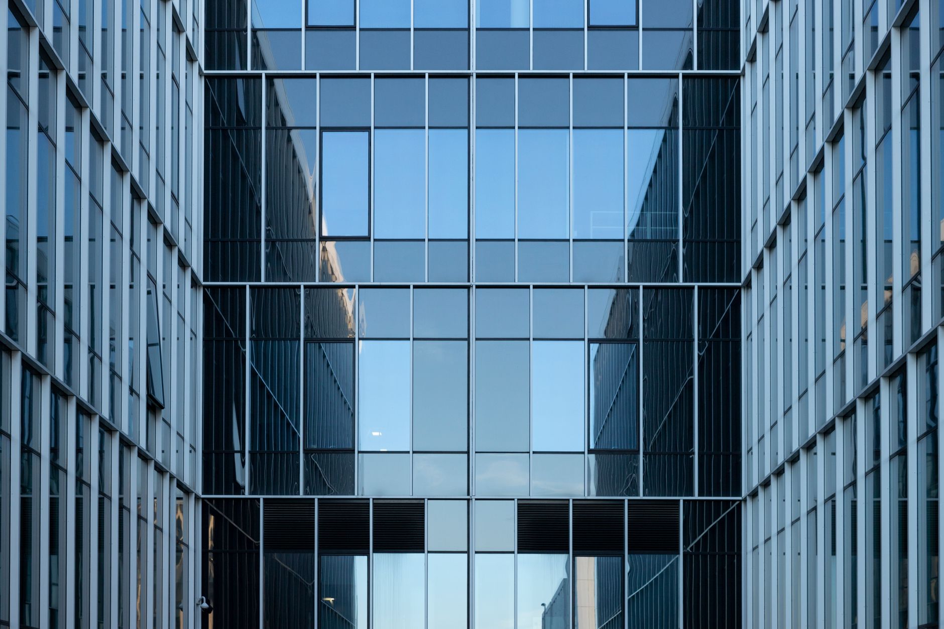 Large corporate office building exterior representing enterprise workforce changes