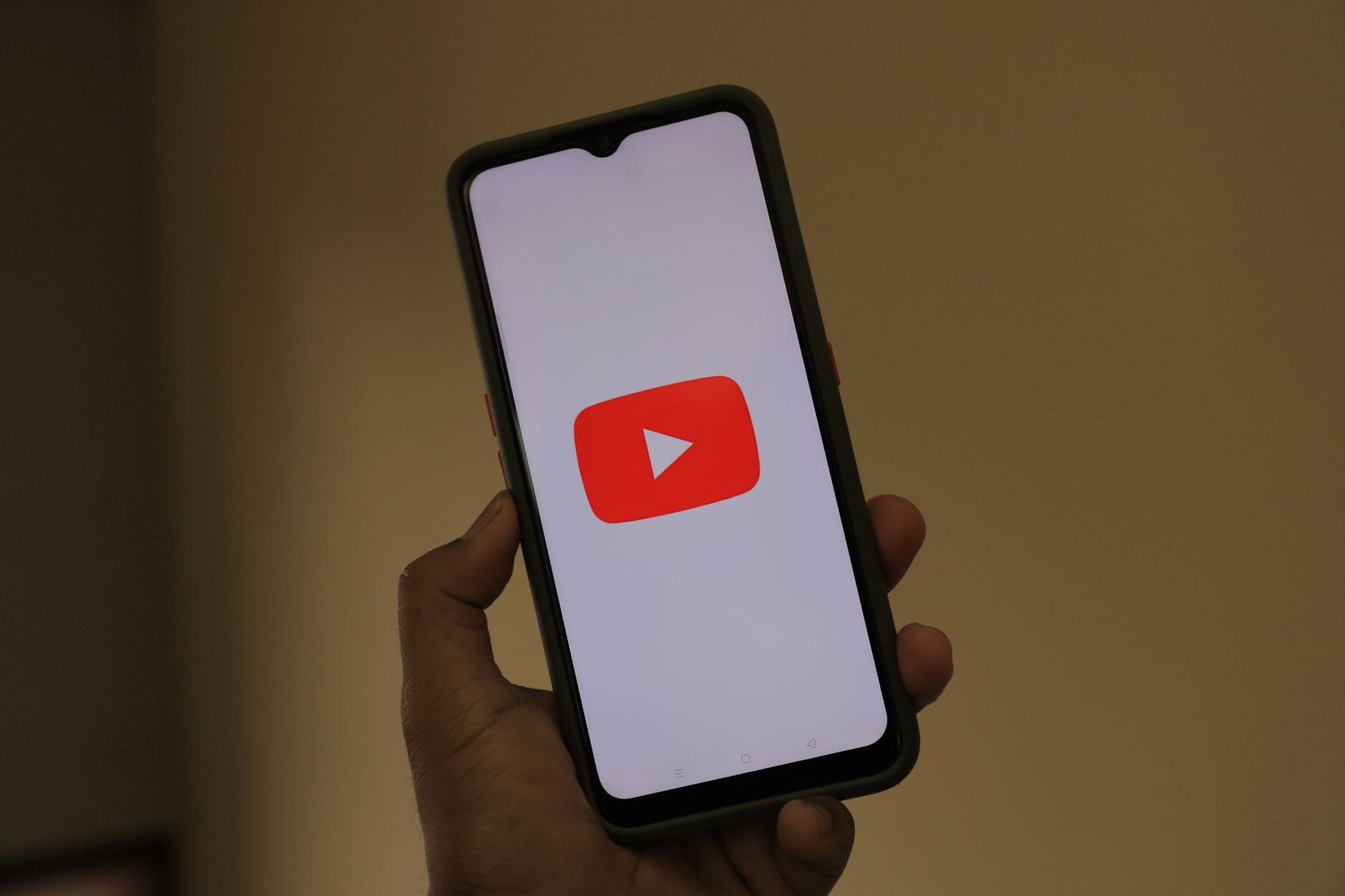 Person browsing a streaming service on a smartphone