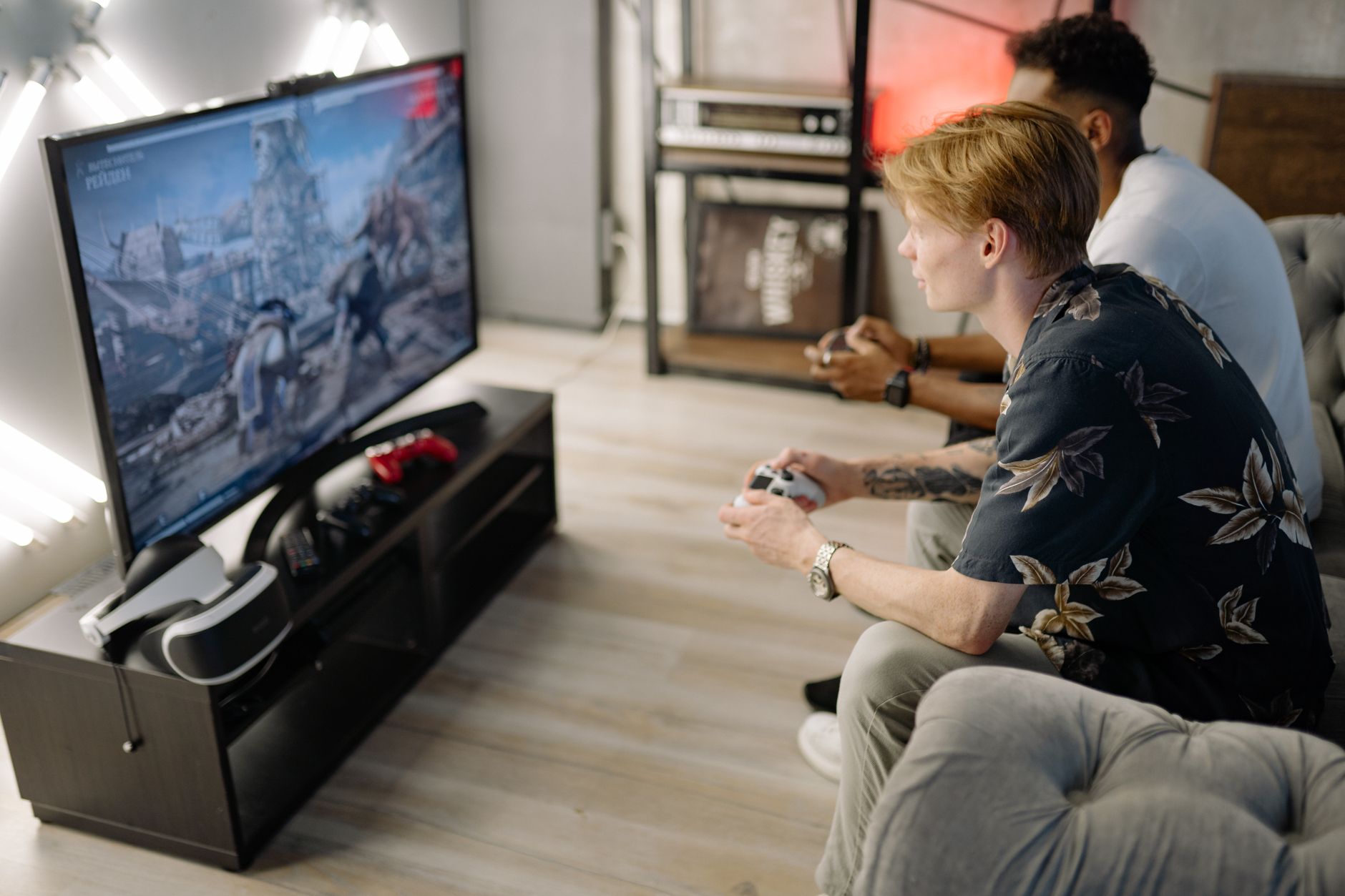 Living room television setup with game controllers on a coffee table