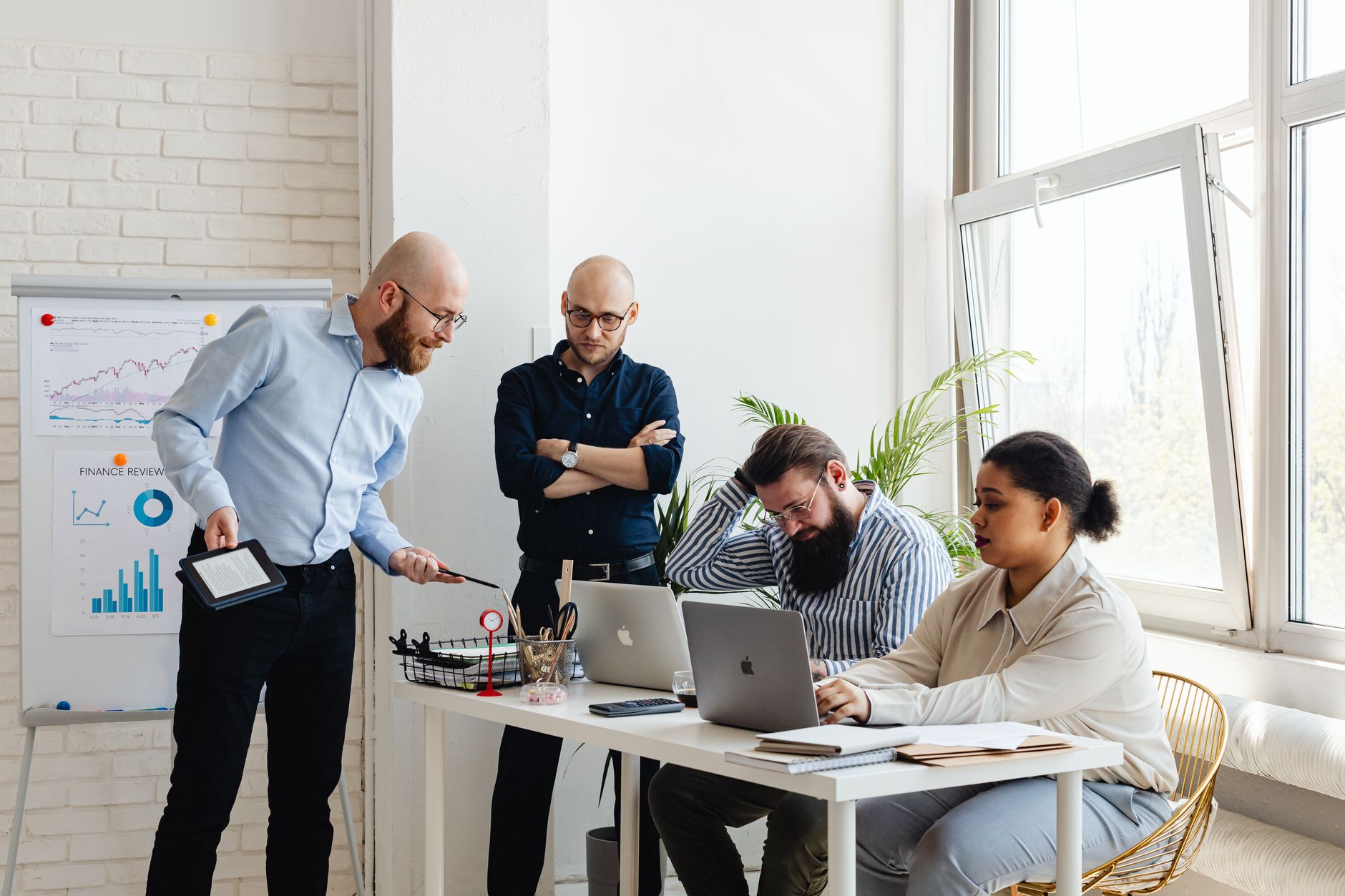 Professionals collaborating in a modern tech office environment