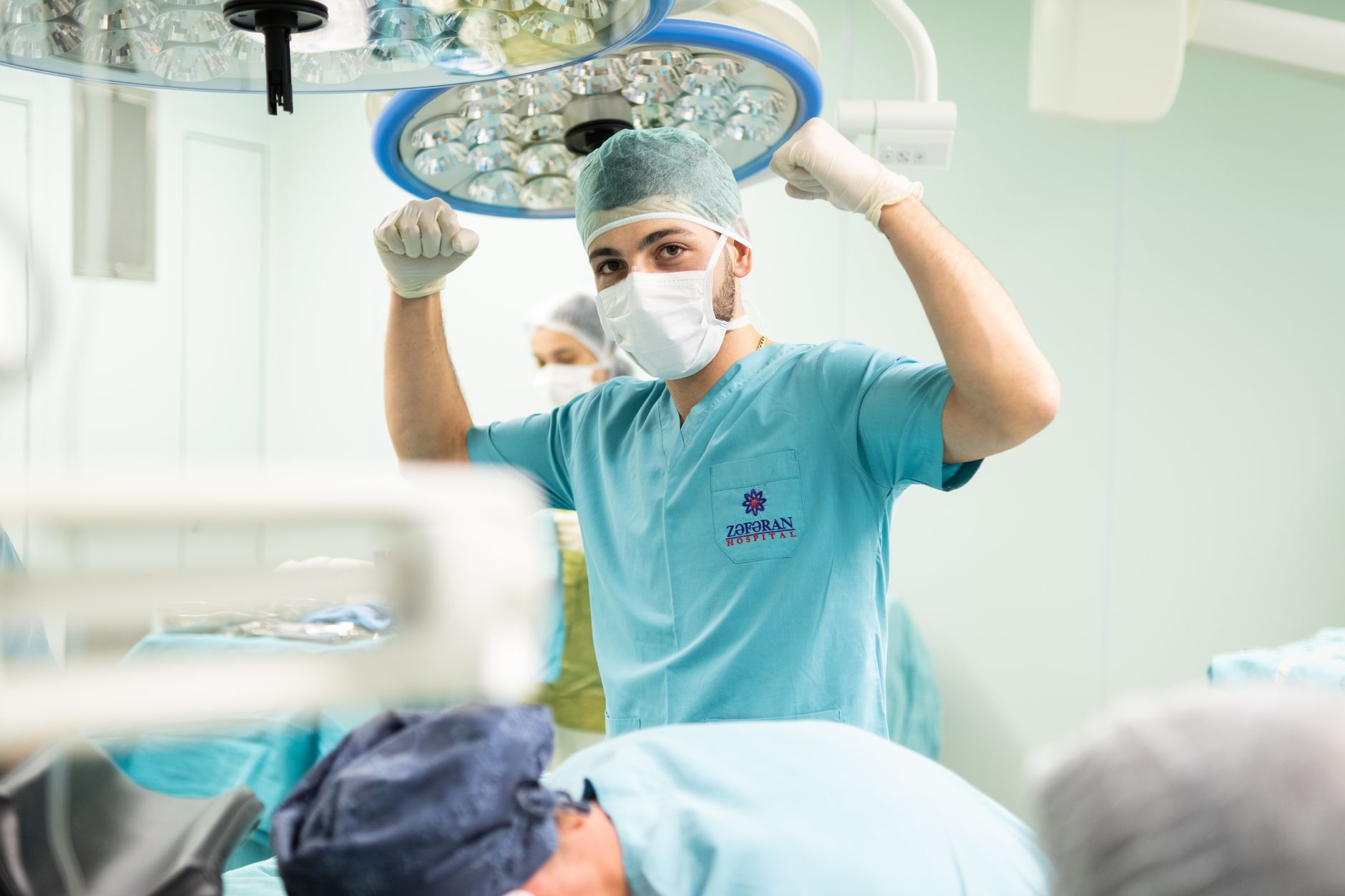Surgeons performing an organ transplant procedure in a hospital operating room