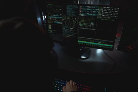 Why Google Gives Hacker Groups Codenames Instead of Real Ones A dark computer screen displaying cybersecurity threat data and code